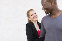 Studio shot of mid adult couple laughing — Stock Photo