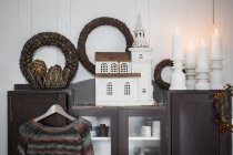 Christmas decorations on cabinet in living room — Stock Photo