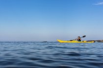 Teenage boy kayaking, differential focus — Stock Photo
