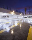 Parking garage illuminated at night with Turning Torso on background — Stock Photo
