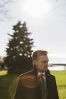 Portrait of businessman in park, focus on foreground — Stock Photo