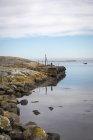 Tranquil landscape with rock groyne, northern europe — Stock Photo