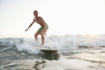 Teenage surfer on wave at Costa Rica — Stock Photo