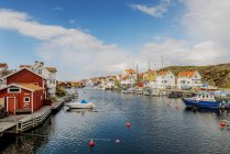 Coastal buildings and boats in bright sunlight — Stock Photo