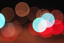 Blue and red spotted bokeh background — Stock Photo