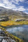 Mountain pool and cloudy sky at More og Romsdal, Norway — Stock Photo