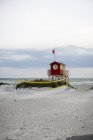 Lifeguard hut on empty beach, kingdom of sweden — Stock Photo