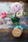 Top view of ranunculus flowers in bottle — Stock Photo