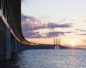 Oresund Bridge and sea in sunset light — Stock Photo
