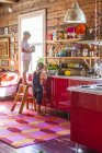 Side view of boys in multicolored kitchen, selective focus — Stock Photo