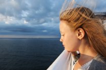 Cute girl with blonde hair on ferry — Stock Photo