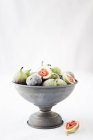 Metal bowl with red and green figs — Stock Photo