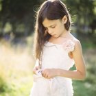 Portrait of girl in white dress, selective focus — Stock Photo