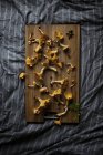 Top view of chanterelles on wooden cutting board — Stock Photo