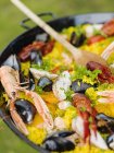 Close up of paella with seafood on grill — Stock Photo