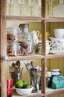 Close-up of kitchen cupboard with different containers — Stock Photo