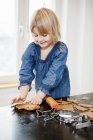 Girl making cookies, selective focus — Stock Photo