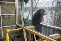 Man building wooden balustrade, selective focus — Stock Photo