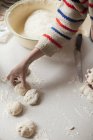 Woman preparing dough on kitchen counter — Stock Photo