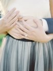 Close-up of hands of newlyweds, selective focus — Stock Photo
