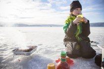 Boy drinking tea outdoors, selective focus — Stock Photo