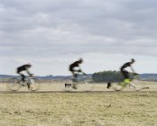 View of blurred cyclists, selective focus — Stock Photo