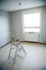 Elevated view of ladder in empty room — Stock Photo