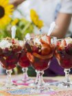 Strawberry gelatin dessert in glasses on table — Stock Photo