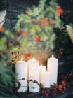 Front view of white candles burning — Stock Photo