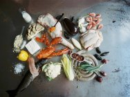 Seafood, meat, vegetables and cooking ingredients — Stock Photo
