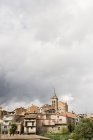 Cloudy sky over old town buildings, Spain — Stock Photo