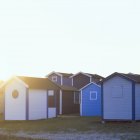 Authentic beach huts in evening sunlight — Stock Photo