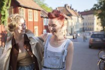 Laughing  young women at road — Stock Photo