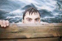 High angle view of man under jetty, selective focus — Stock Photo