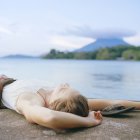 Young woman relaxing, focus on foreground — Stock Photo