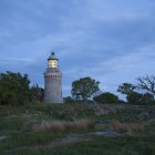 Vista panorâmica do farol iluminado ao entardecer, Dinamarca — Fotografia de Stock