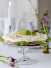 Keylime pie served with mint on cake stand — Stock Photo