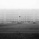 Residential building in fog, black and white — Stock Photo