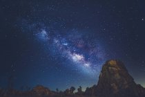Milky Way stars shining rocky mountains — Stock Photo
