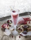 Glass of cold cherry cocktail on silver tray — Stock Photo