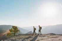 Side view of man and woman walking at Taft Point — Stock Photo