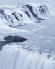 Flow of Gullfoss waterfall with steam on Hvita river in Iceland — Stock Photo