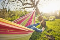 Low section of woman lying down on hammock — Stock Photo