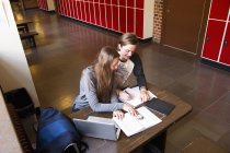 Students learning at school, focus on foreground — Stock Photo