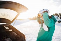 Man by car on snow, focus on foreground — Stock Photo