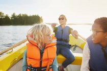 Woman and children in rowboat, selective focus — Stock Photo
