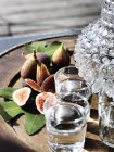 Close-up of figs on wooden table, selective focus — Stock Photo