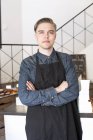 Portrait of young baker, focus on foreground — Stock Photo