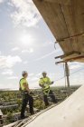 Construction workers on roof, selective focus — Stock Photo