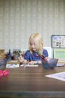 Girl painting at Nordic Watercolor Museum, differential focus — Stock Photo